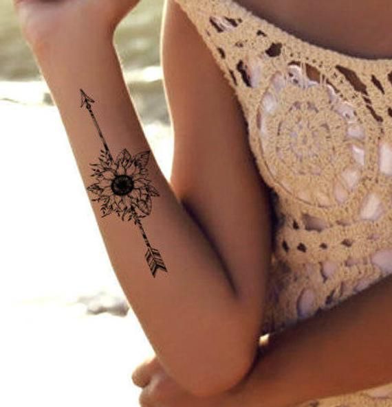 Tattoos von flechas con nombre 23