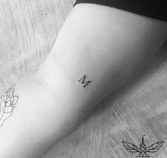 Tatuajes de nombres en el cuello 14