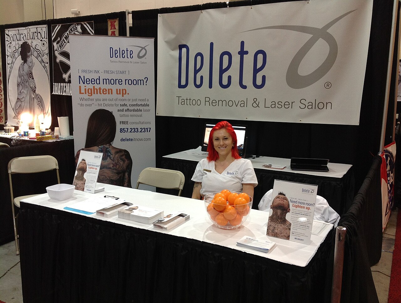 A company offering tattoo removal information at the Boston Tattoo Convention in 2013.
