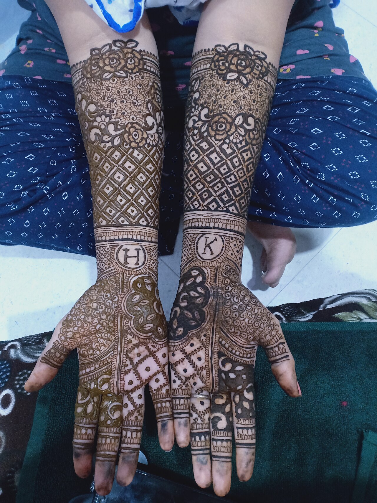 Henna is a natural dye made from the leaves of the henna plant, which is used to create intricate designs on the skin, particularly on the hands and feet. The application of henna on the hands is a co