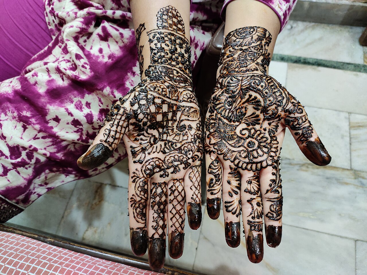This is traditional henna art done in India during many occasions. This strains the hand after leaving for some time and remains for few days as a temporary tattoo.