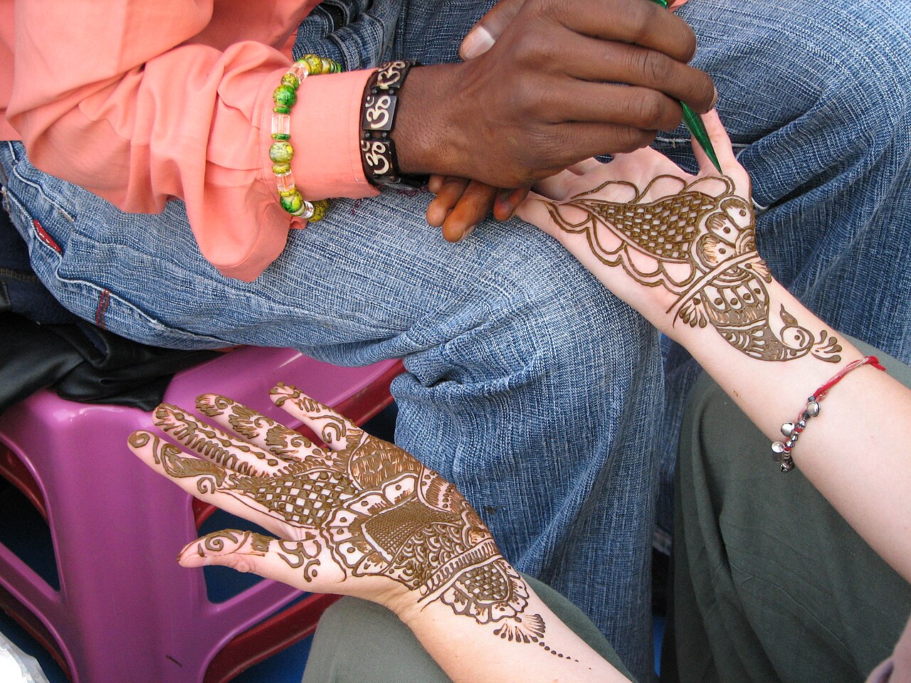 Devon getting henna tattoos on her hands. Her artisan was super-fast and percise. Some of the fine detail he managed was amazing.