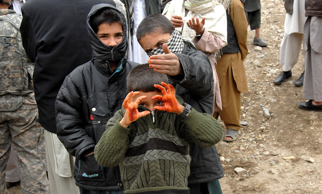 Two boys proudly display their Henna painted hands and fingers.Photo by David Elmore of the United States of America.
