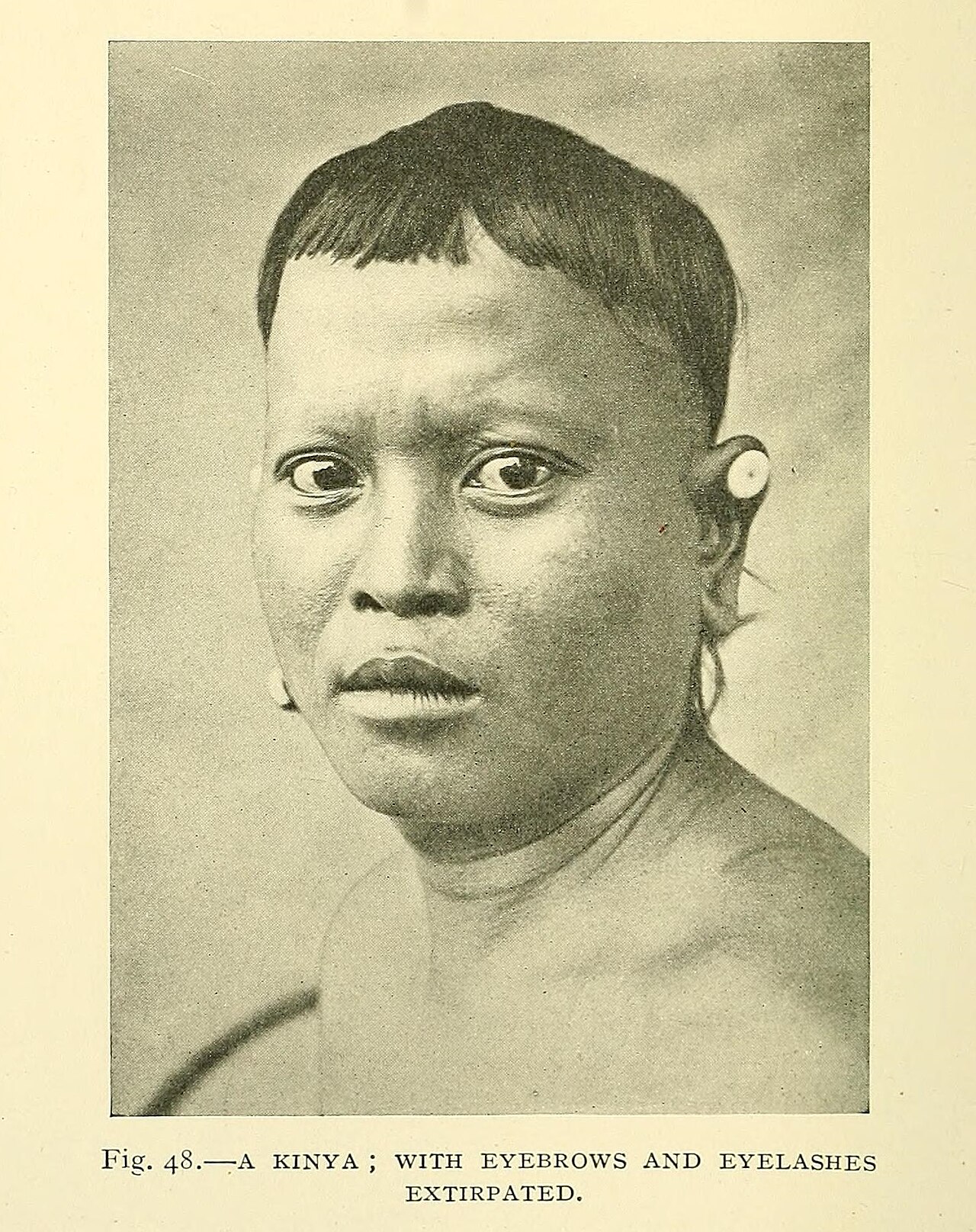 "A Kinya (tribe of inland Borneo) with eyebrows and eyelashes extirpated"