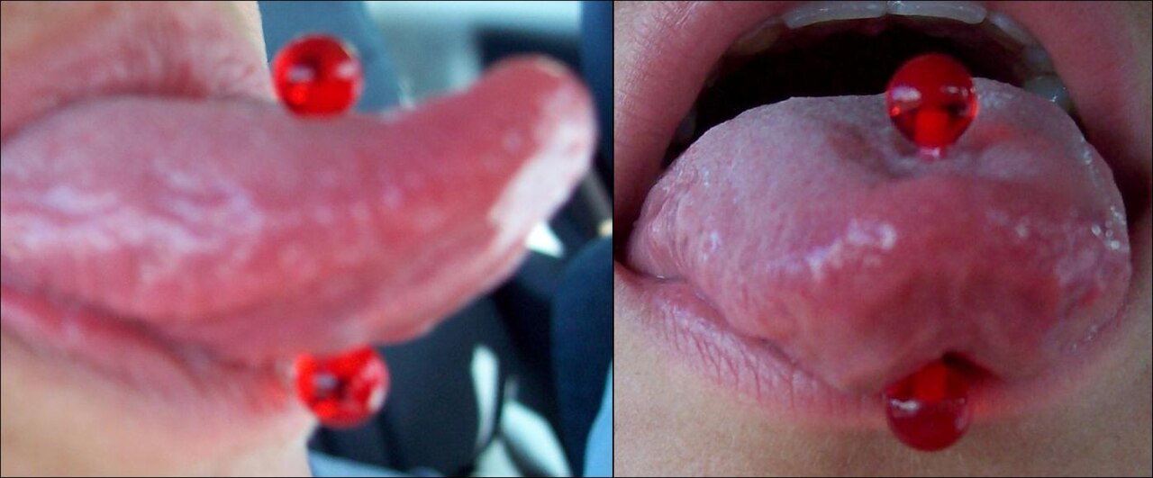Tongue piercing with barbell.