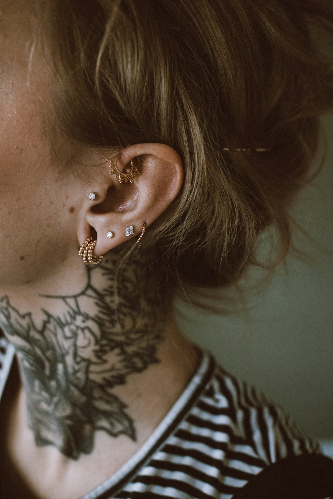 a woman with a tattoo on her ear