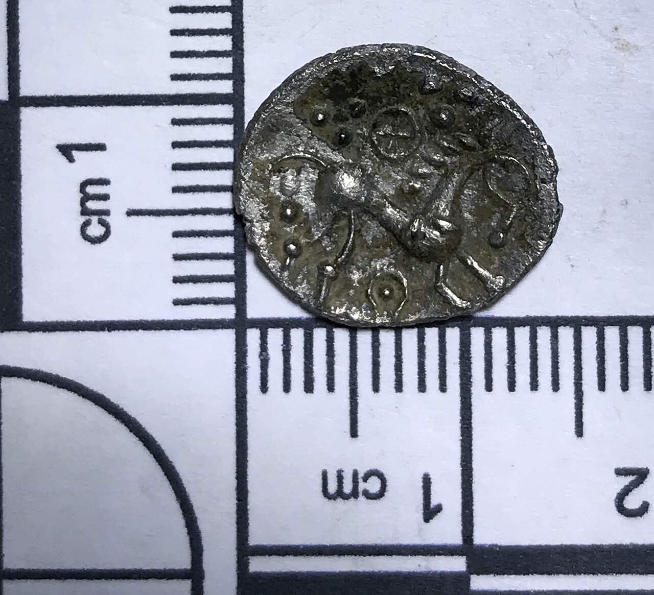 A silver uninscribed Iron Age unit of the East Anglian region / Iceni, dating to the period c.20 BC-AD 40, 'Norfolk Boar Phallic' type. Obverse: Stylised boar right, single front leg, spear in front p
