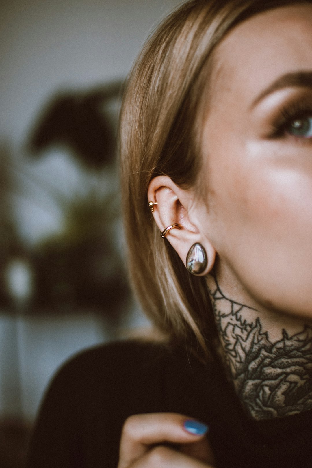 a woman with a tattoo on her ear