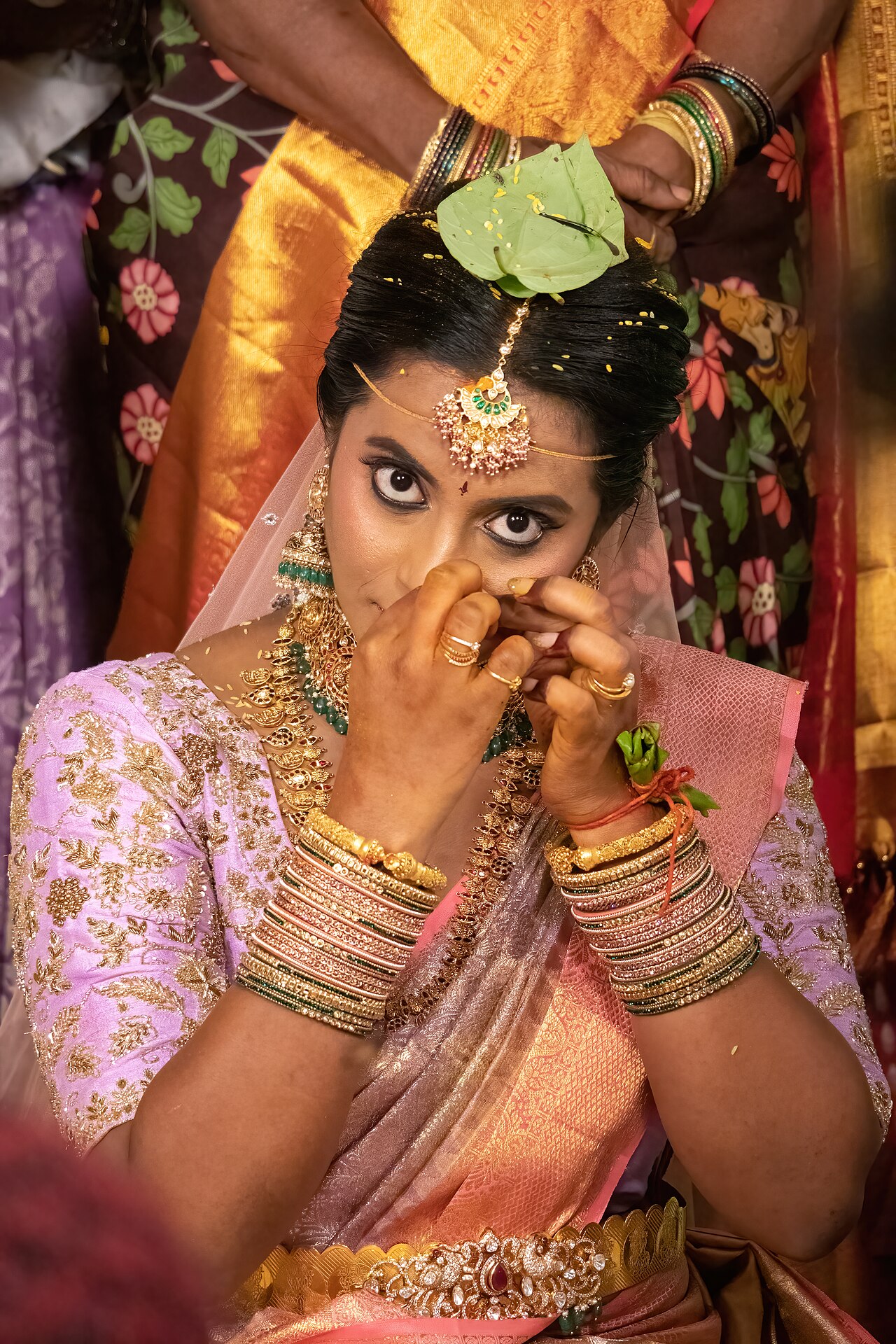 In the Hindu culture, the nose ring on a women signifies as a symbol of being married