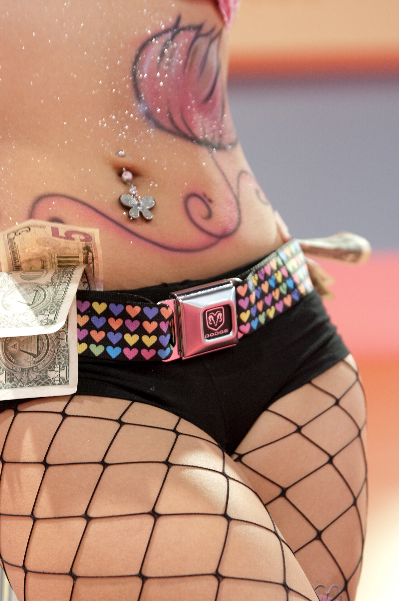 Navel piercing, female tummy.
