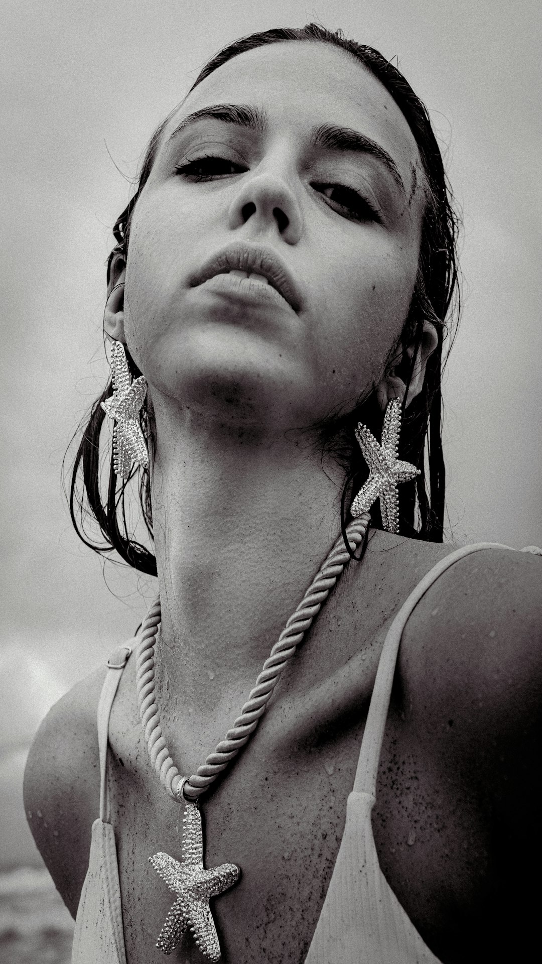 Woman with starfish necklace and earrings