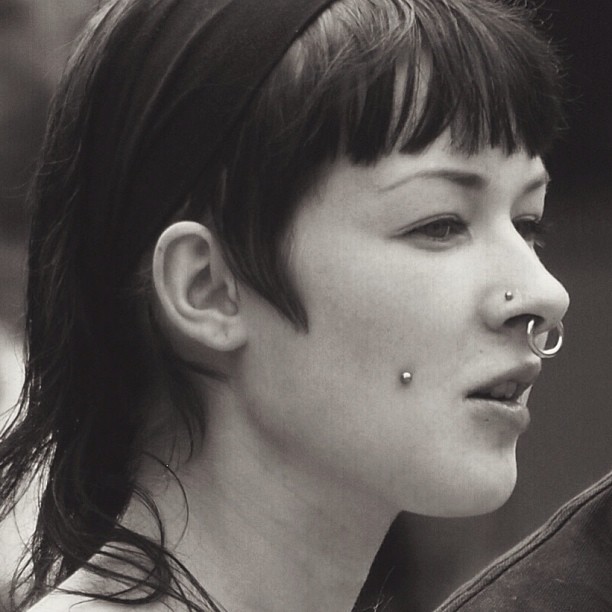 Woman with nose and cheek piercings