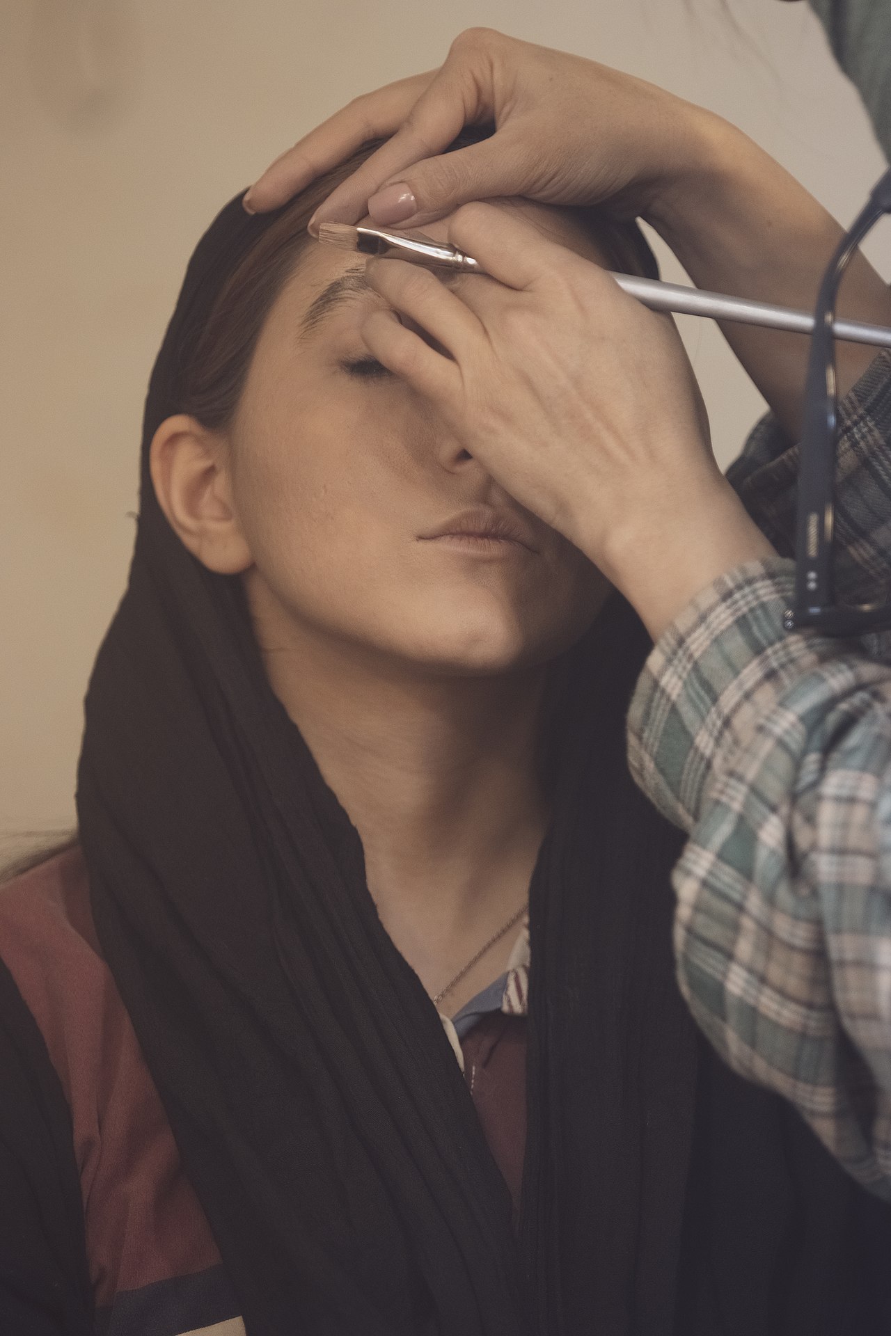 A make-up artist, also called a makeup artist, and often shortened to MUA, is an artist whose medium is the human body, applying makeup and prosthetics on others for theatre, television, film, fashion
