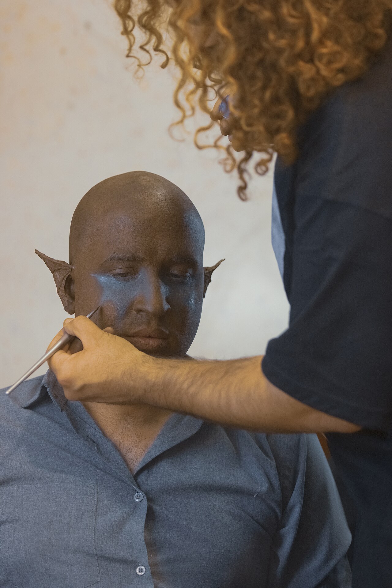 A make-up artist, also called a makeup artist, and often shortened to MUA, is an artist whose medium is the human body, applying makeup and prosthetics on others for theatre, television, film, fashion