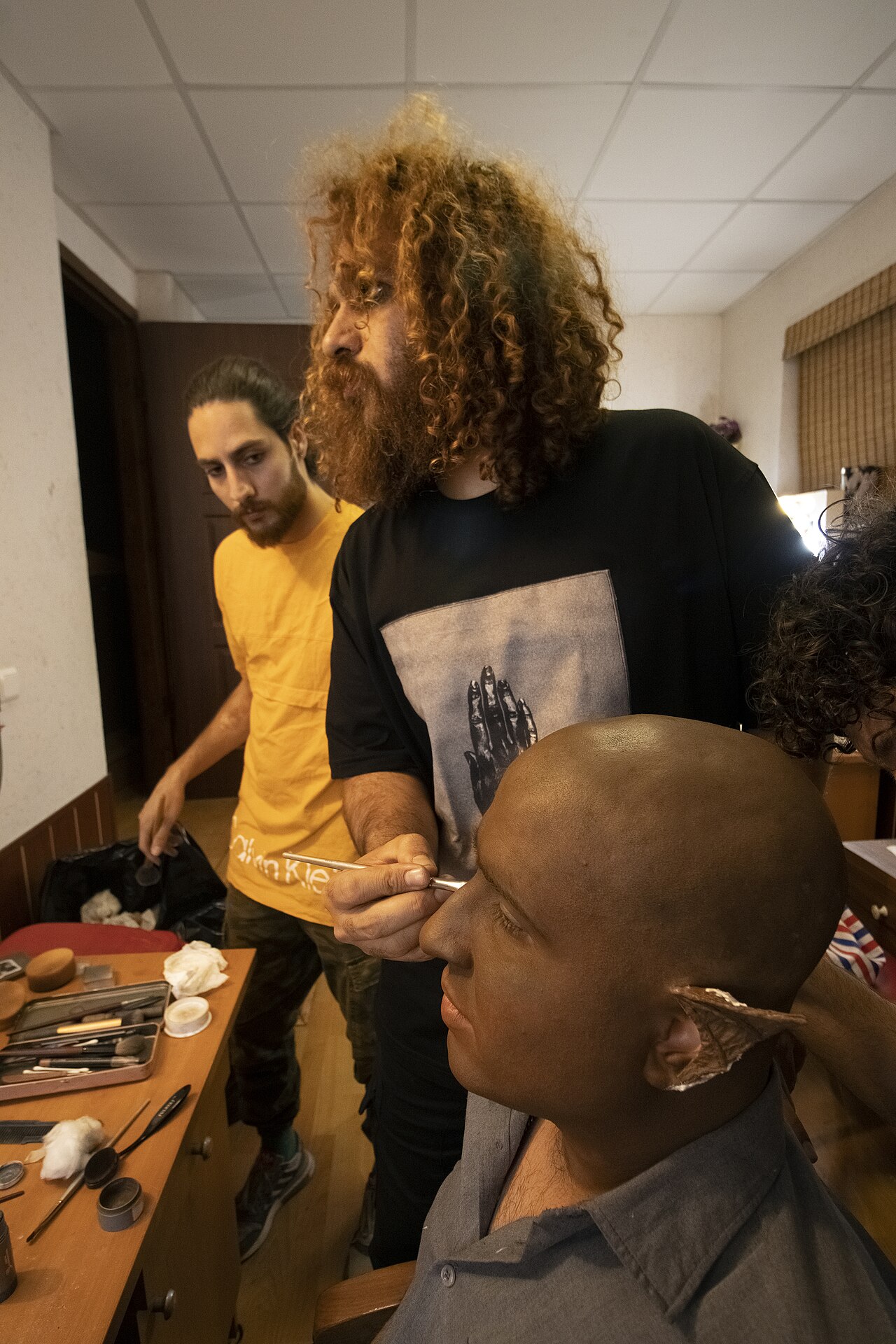 A make-up artist, also called a makeup artist, and often shortened to MUA, is an artist whose medium is the human body, applying makeup and prosthetics on others for theatre, television, film, fashion