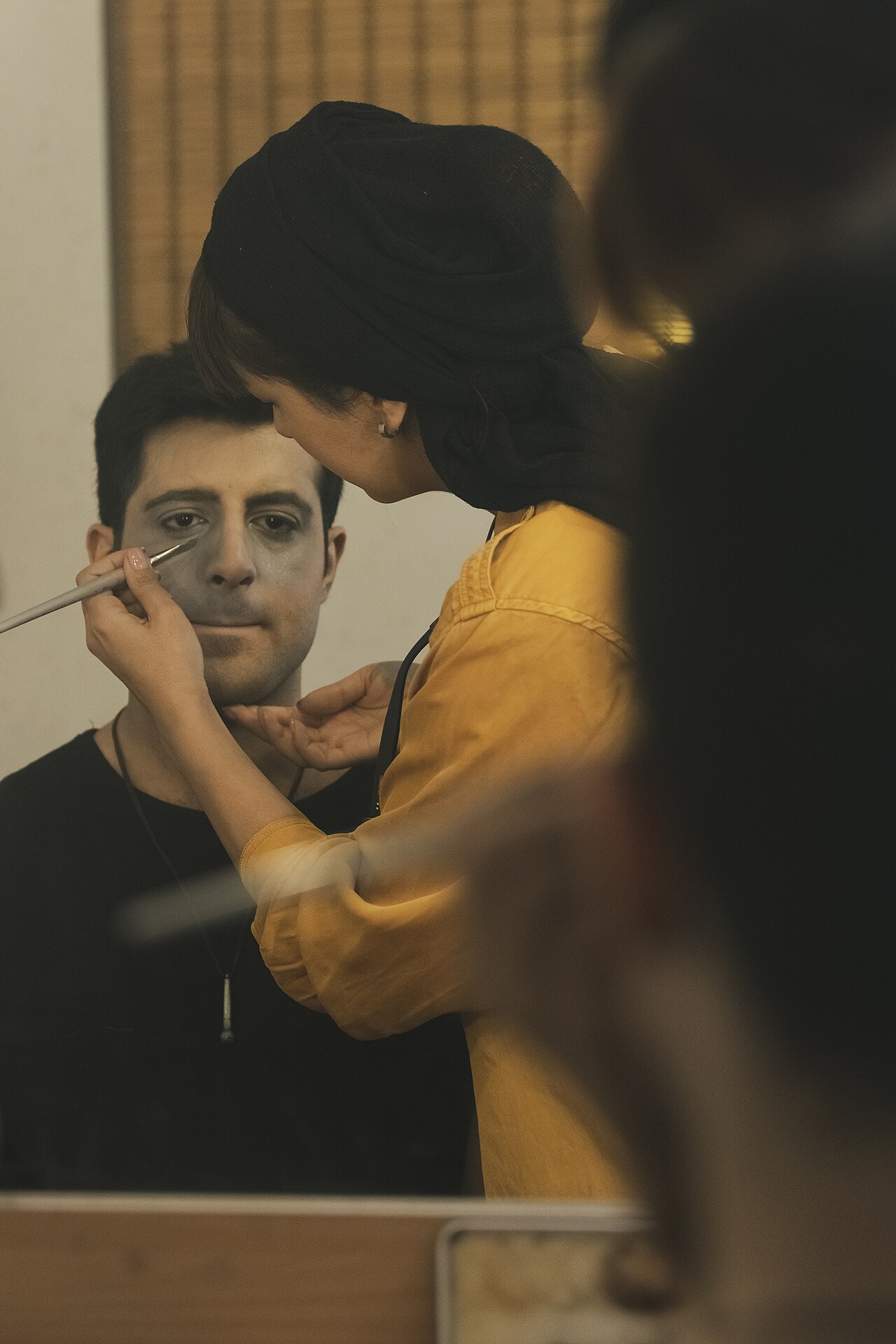 A make-up artist, also called a makeup artist, and often shortened to MUA, is an artist whose medium is the human body, applying makeup and prosthetics on others for theatre, television, film, fashion