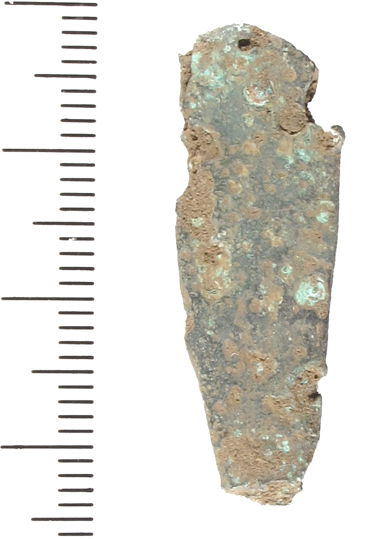 A worn and damaged late Saxon copper alloy strap end, Thomas type A. The strap-end is tongue-shaped and a rivet hole at the bifurcated attachment-end. The rest of the body is worn, and the perimeter i
