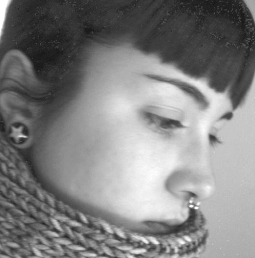 Earplug and nose piercing.