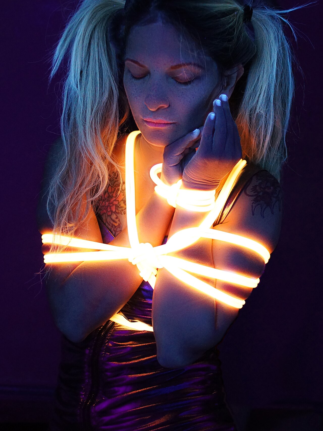 Blacklight Shibari with fluorescent ropes is a project of blacklight artist Beo Beyond and shibari artist Angela Nawa.Blacklight Shibari is an unconventional live show, a modern interpretation of th